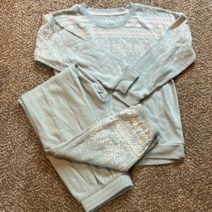 Adorable pajama set in cool ice blue with snowflake design.
